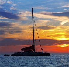 Ibiza san Antonio Abad de Portmany catamaran sailboat sunset with in Balearic islands of spain