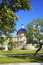 Valencia Turia river park with San Pio V museum dome in background at Spain