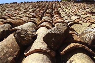 Clay roof tiles old aged arabic style in Spain perspective