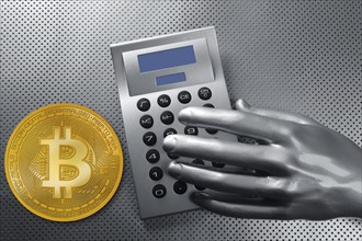 Calculator with bitcoin btc coin and futuristic silver hand