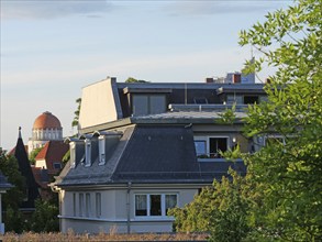 Above the rooftops of Leipzig: View of the dome of the Wünschmannhaus and Uniriese. Saxony,