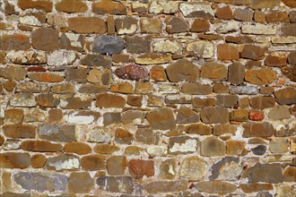 Colorful masonry wall stone construction house in Pyrenees