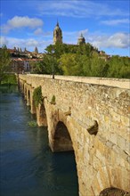 Salamanca skyline and roman bridge over Tormes river in Spain