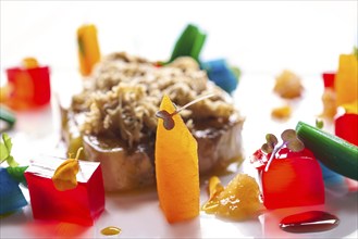 Foie slice with grated white truffle and colorful jelly decoration