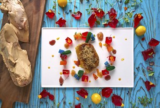 Foie slice with grated white truffle and colorful jelly decoration