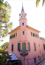 Barcelona house of Gaudi in Park Guell pink facade building