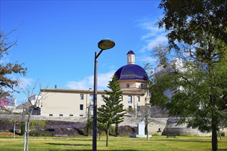 Valencia Turia river park with San Pio V museum dome in background at Spain