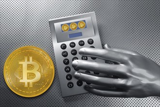 Calculator with bitcoin btc coin and futuristic silver hand