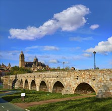 Salamanca skyline and roman bridge over Tormes river in Spain