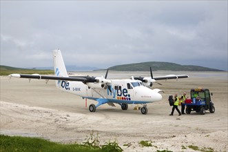 Flybe plane on sandy airstrip Isle of Barra airport, Barra, Outer Hebrides, Scotland, UK