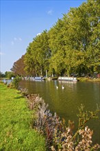 Boats on the River Thames in autumn at Lechlade on Thames, Gloucestershire, England, UK