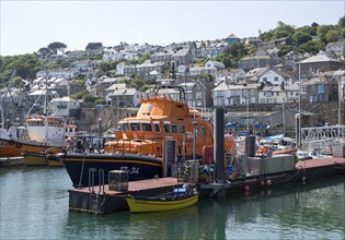 RNLI lifeboat in the harbour of fishing port of Newlyn, Cornwall, England, UK