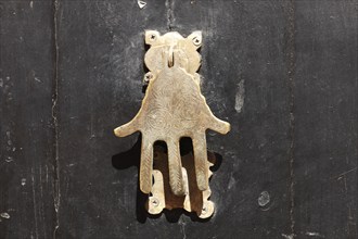 Door knocker as the hand of Fatima, Marrakech, Morocco, Africa