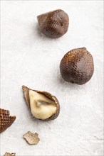 Salak or snake fruit on gray concrete background. Side view, close up. Tropical, healthy food,