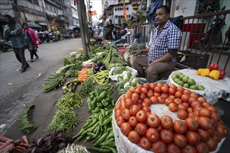 Vendor selling vegetables at a market, ahead of the presentation of the Interim Budget 2024 by