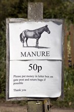 Horse manure 50p a bag sign, Suffolk, England, UK 2010