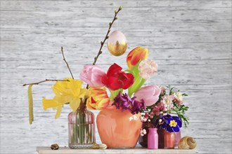 Picturesque still life with flowers and Easter egg, Germany, Europe