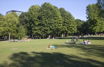 People in summer enjoying the greenery and calm of Het Park, central Rotterdam, Netherlands