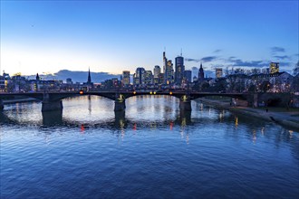 Skyline of the city centre of Frankfurt am Main, river Main, dusk, Ignatz-Bubis-Brücke, Hesse,