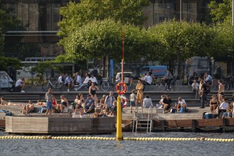 Summer, swimming in the harbour of Copenhagen, there are official bathing places, harbour baths and