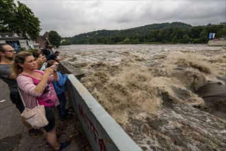 Weir of the Lake Baldeney in Essen, the masses of water roar through the open weirs, high water on