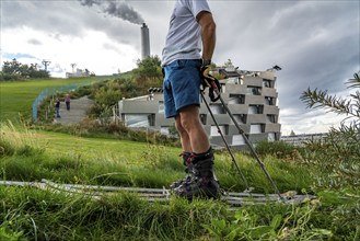 CopenHill, waste incineration plant and artificial ski slope, skiing with a view of the ski lift,