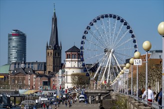 Rhine promenade in Düsseldorf, Ferris wheel, old castle tower, St Lambert's basilica, old town,