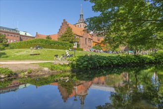 Odense, green area, monastery, brick building, stepped gable, tower of the cathedral church, St.