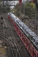 Freight train, car train with Landrover new cars on the goods train line at the Hagen-Vorhalle