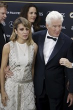 Richard Gere with woman Alejandra Gere at the premiere of Wisdom of Happiness, A heart-to-heart