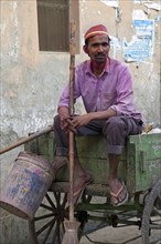 Indian garbage man on wooden cart in Vrindavan, Uttar Pradesh, India, Asia