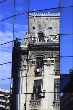 In the centre, office building, bank building, glass facade, reflection in the modern BCR bank