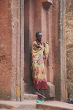 Rock churches in Lalibela, pilgrims at the entrance to the rock church of St George, Bete Kiddus