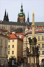 View of St Vitus Cathedral and the castle complex from Lesser Town Square with the Holy Trinity