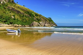 Speedboat on the sand of Bonete beach on the island of Ilhabela on the coast of Sao Paulo,