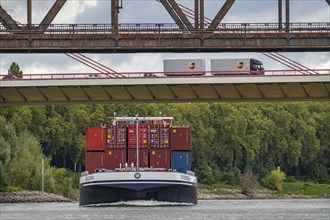 The Beeckerwerth Rhine bridge of the A42 motorway, truck traffic, in front of it the Haus-Knipp