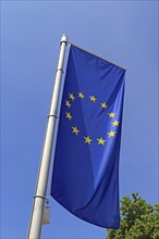 Flag of the European Union in front of a blue sky