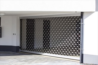 Roller shutter door at the entrance to the underground car park of a residential complex