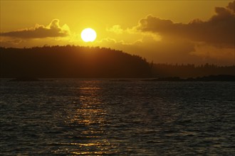 Romantic sunset over an island, Tofino, Vancouver Island, Canada, North America