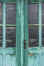 Old dilapidated turquoise door, detail, transom window, wood, wooden door, colour, peeled off,