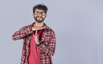 Smiling man gesturing time out isolated. Young Man making time out gesture isolated