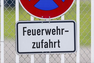 Signs on an airport barrier fence, absolute stopping ban, fire brigade access road, Stuttgart,