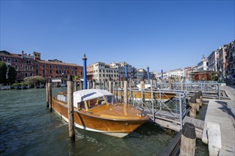 Water taxi at a jetty on the Grand Canal, Venice, Veneto, Italy, Europe