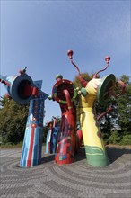 Sculpture of the Nessy family in bright colours, sea monster, aeration structure for Düsseldorf's