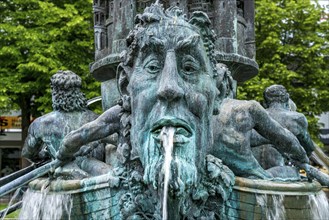 Detail of the historical column of the fountain on Josef-Görres-Platz in the historic centre of