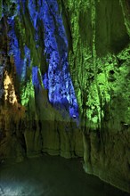 Stalactites illuminated by coloured LED light, stalactite cave, Höllgrotten, Baar, Canton Zug,