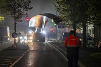 Transport of a 68 metre long, 22 tonne blade of a wind turbine, here in Breckerfeld, with a