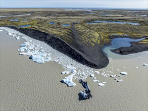 Aerial view over the glacial lake Fjallsárlón, glacier Fjallsjökull, part of Vatnajökull glacier,