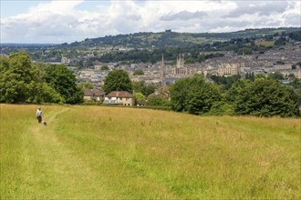 View over Bath city centre from Smallcombe, Widecombe, Bath, Somerset, England, UK with woman