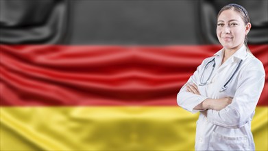 Portrait of female doctor with arms crossed with German flag background. Healthcare concept with